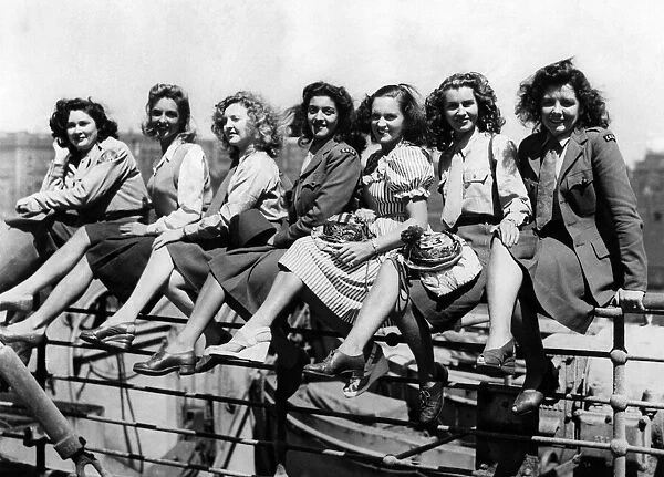 Some of the ENSA girls grouped on the ships rails on board the Empress of Scotland before
