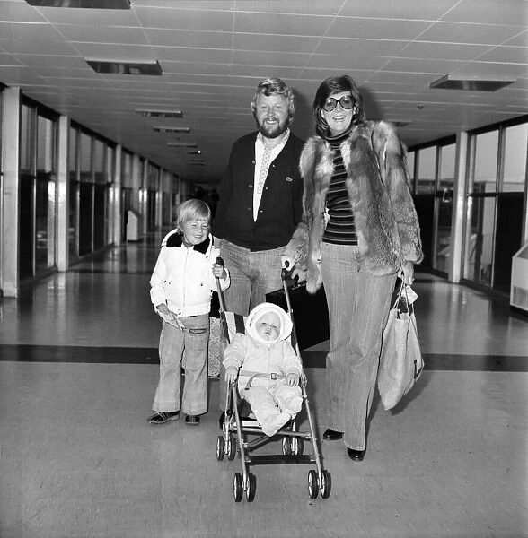 Entertainer Cilla Black seen here at Heathrow Airport with her husband and children