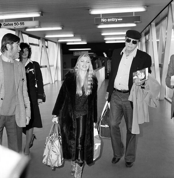 Entertainment: Film: Actor: Lynsey De Paul arriving at Heathrow Airport with Burt
