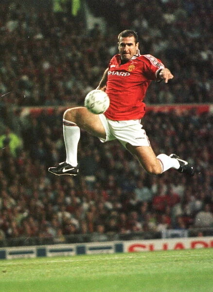 Eric Cantona jumping to control a ball Aug 1998