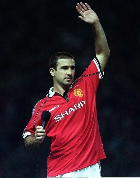 Eric Cantona waving to Manchester United fans Holding microphone after Munich