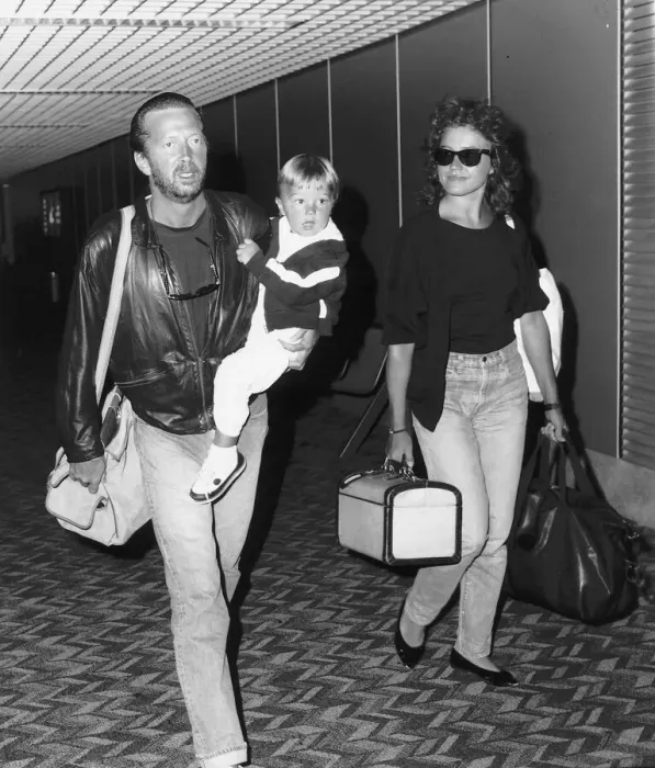 Framed Print : Eric Clapton singer songwriter and girlfriend Lori Del Santo walk through airport with Framed Print : Eric Clapton singer songwriter and girlfriend Lori Del Santo walk through airport with