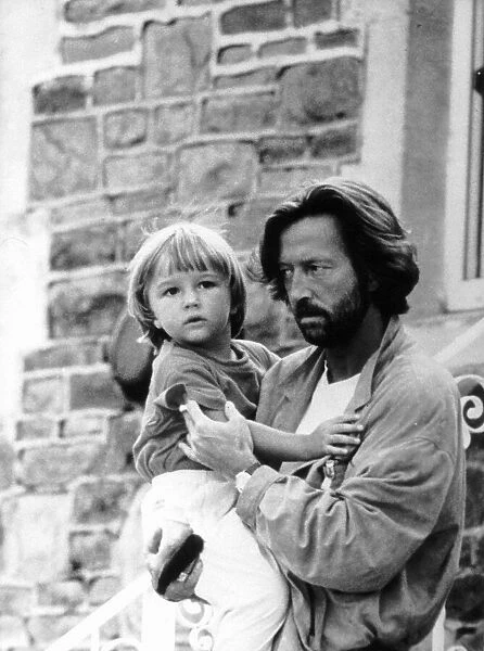 Eric Clapton singer and songwriter holds his son Conor