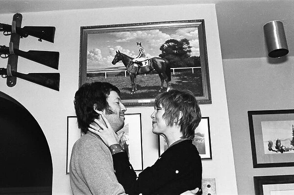Eric Clapton and wife Pattie Boyd, pictured in front of a photograph of his racehorse Via