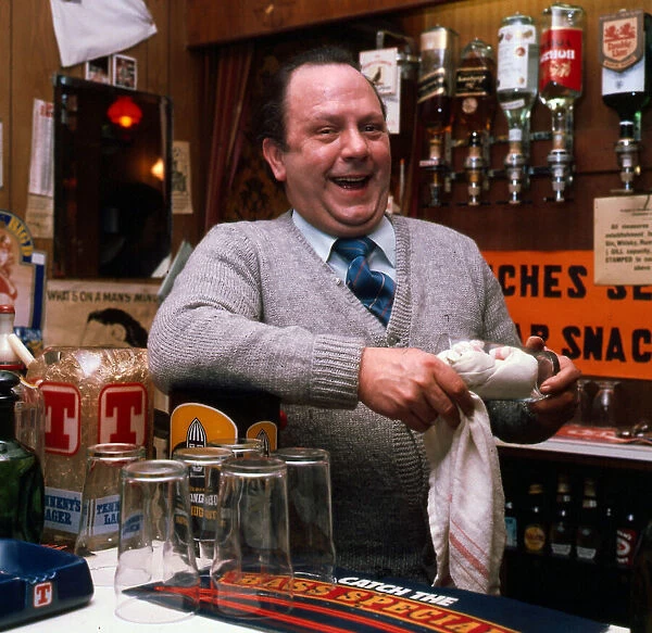 Eric Milligan working behind bar 1976