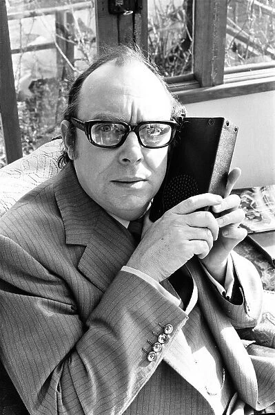 Eric Morecambe, Comedian & Luton FC Director, listens to match report on the radio