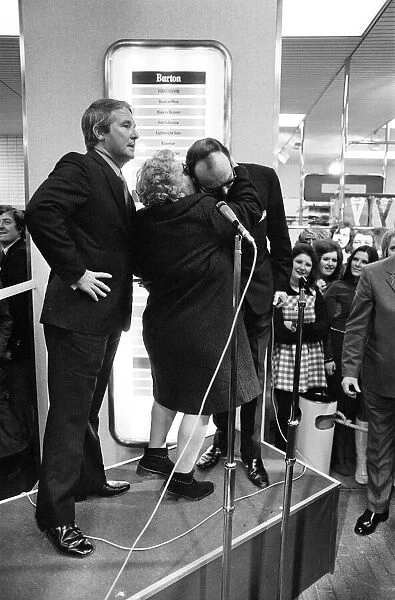 Eric Morecambe and Ernie Wise, accompanied by Miss Great Britain Carolyn Moore