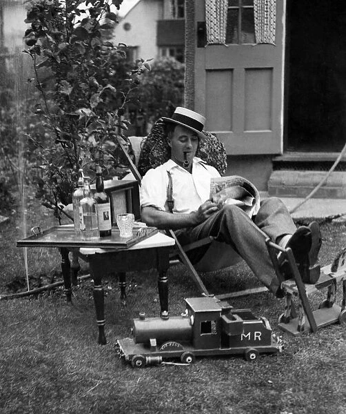 Ernest Barnes of Motspur Park, New Malden, relaxes at home in his garden