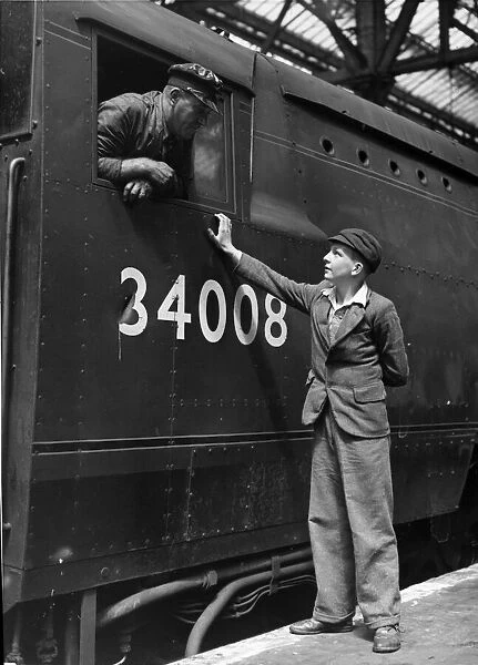 Ernet Spencer, 13, from the Falklands sees a train for the first time. July 1951