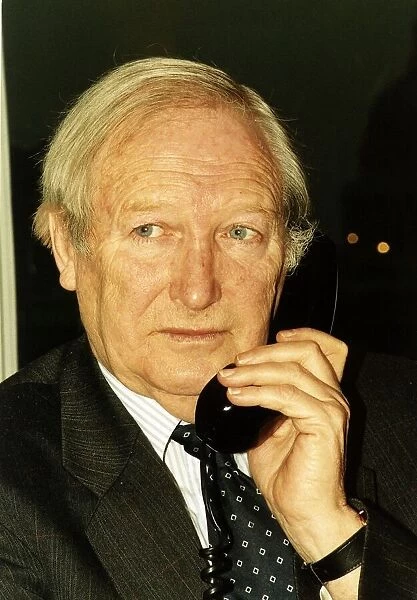 Ernie Burrington MGN chairman holding a telephone
