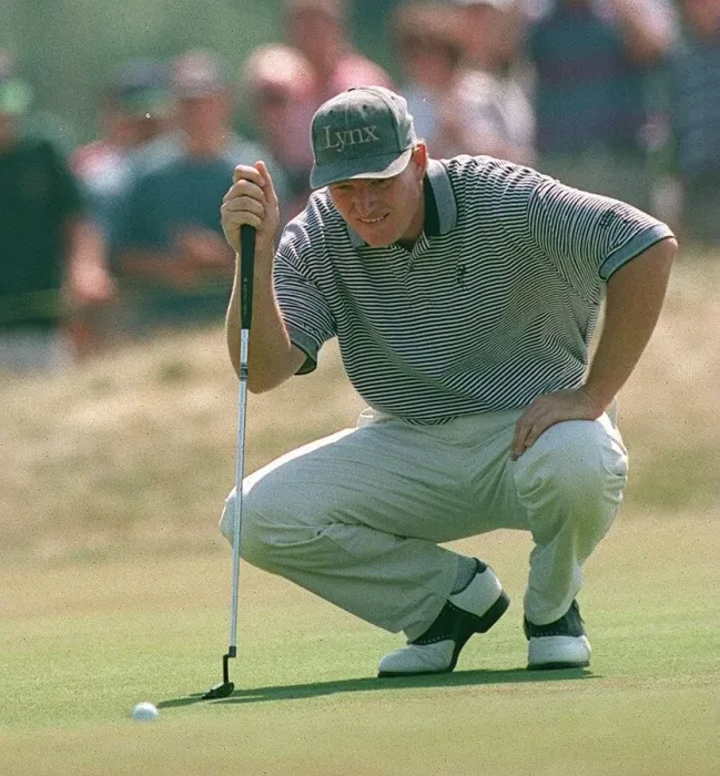 Framed Print : Ernie Els lines up a putt at Lytham golf open wearing Lynx skip cap kneeling Framed Print : Ernie Els lines up a putt at Lytham golf open wearing Lynx skip cap kneeling