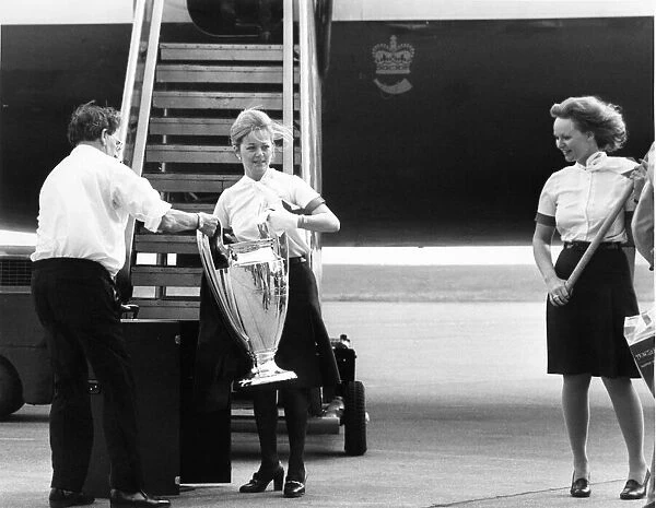 The European Cup in the safe hands of a British Airways stewardess at Speke Airport as