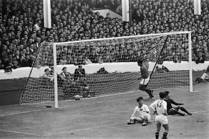 Framed Print : Eusebio scores for Portugal during world cup 1966 against North Korea Framed Print : Eusebio scores for Portugal during world cup 1966 against North Korea