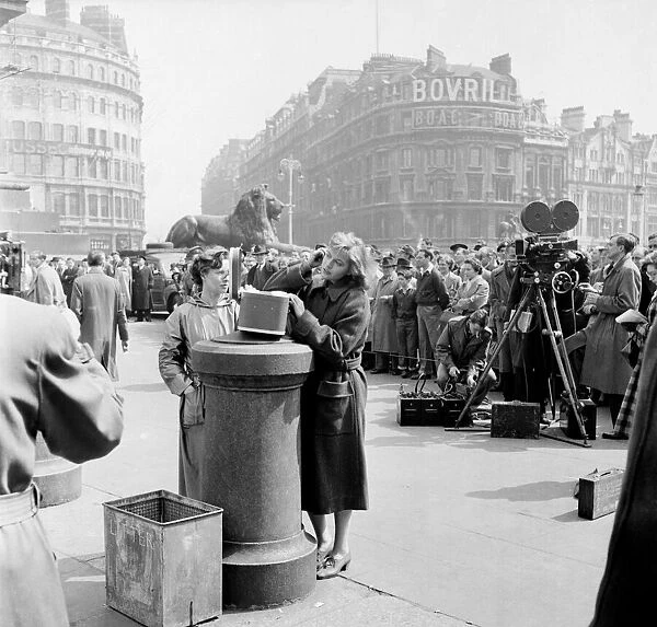 Eva Bartok seen here making adjustments to her hair in between filming in Trafalgar