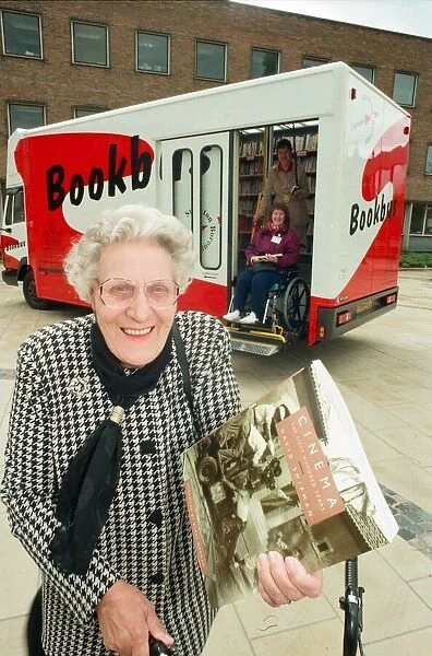 Eva Sharp with the first book from the new Book Bus, launched in Stockton