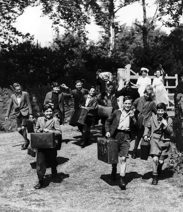 Framed Print : Evacuated children leave with their cases from their Leicestershire home as they head for Framed Print : Evacuated children leave with their cases from their Leicestershire home as they head for