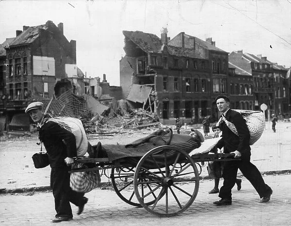 Evacuating a sick man on a wheeled stretcher through Louvain, Belgium