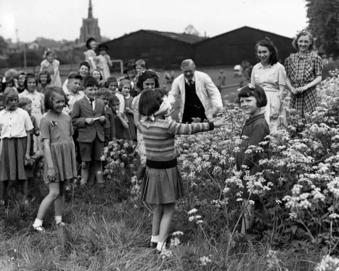 Framed Print : Evacuees at a farewell party, playing a game of Blind Mans Bluff Framed Print : Evacuees at a farewell party, playing a game of Blind Mans Bluff