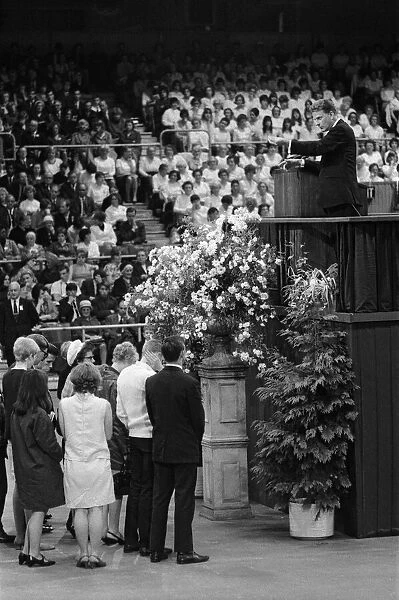 Evangelist Billy Graham addresses a crowd of 19000 people at Earls Court, London