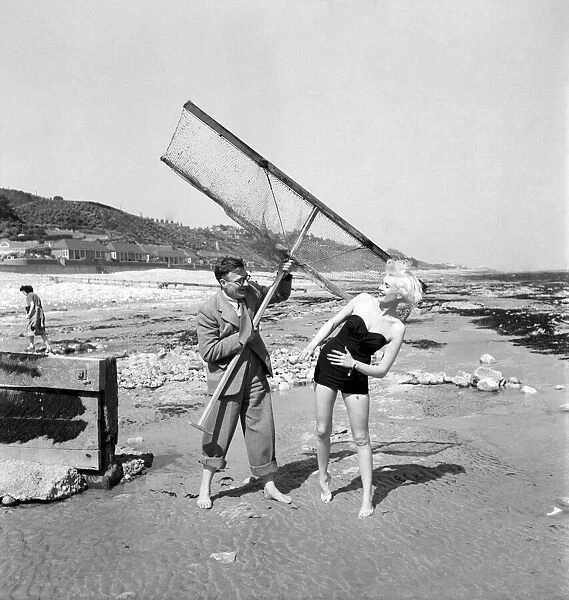 Eve Lynd American actress with shrimping net. May 1950 O24324-001