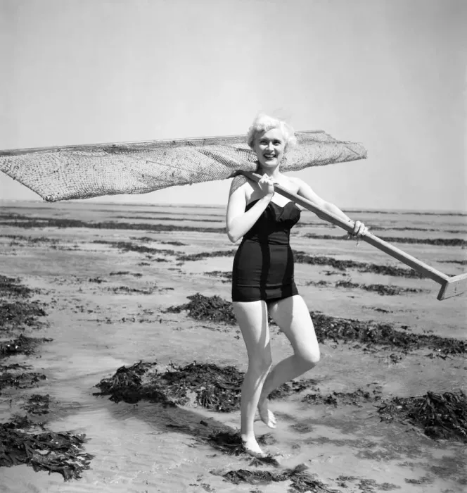 Framed Print : Eve Lynd American actress with shrimping net. May 1950 O24324 Framed Print : Eve Lynd American actress with shrimping net. May 1950 O24324