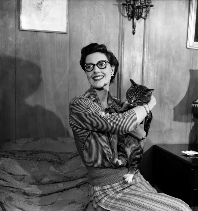 Framed Print : Eve Wynn. Mannequin who wears glasses and looks glamorous seen here with her pet cat Framed Print : Eve Wynn. Mannequin who wears glasses and looks glamorous seen here with her pet cat