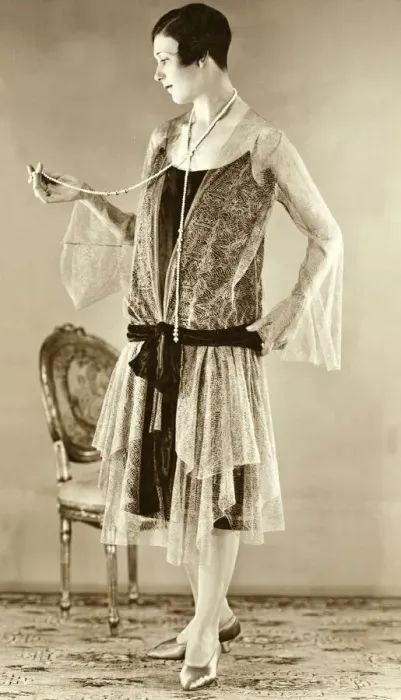 Framed Print : Eveningwear circa 1925. Woman modelling the trends of 1926 Framed Print : Eveningwear circa 1925. Woman modelling the trends of 1926