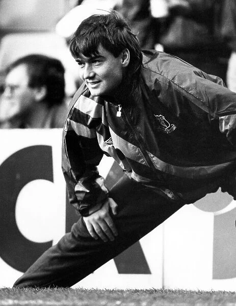 Everton football player Ian Snodin pictured warminh up on the sidelines during his