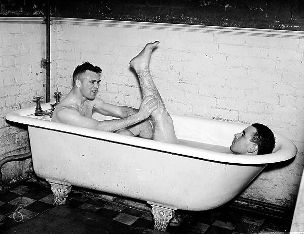 Everton footballers JN Cunliffe (left) and W Cook in the bath after training