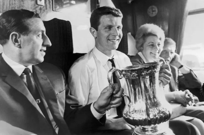 Framed Print : Everton manager Harry Catterick holds the FA Cup trophy on the train journey back to Framed Print : Everton manager Harry Catterick holds the FA Cup trophy on the train journey back to
