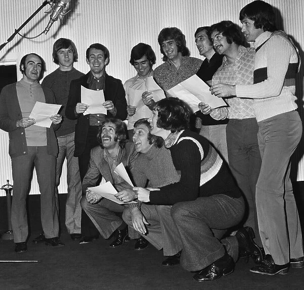 Everton players cut a disc 'For Ever Everton'at the Strawberry Studios in