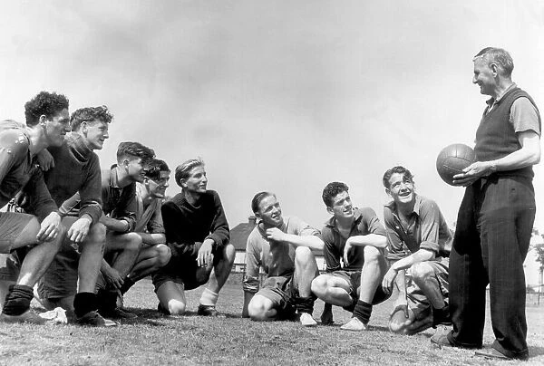 Everton players pictured with coach Harry Cooke during a training session
