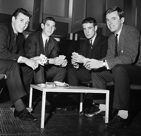 Everton players relax at Ringway airport, Manchester, while waiting for their plane to