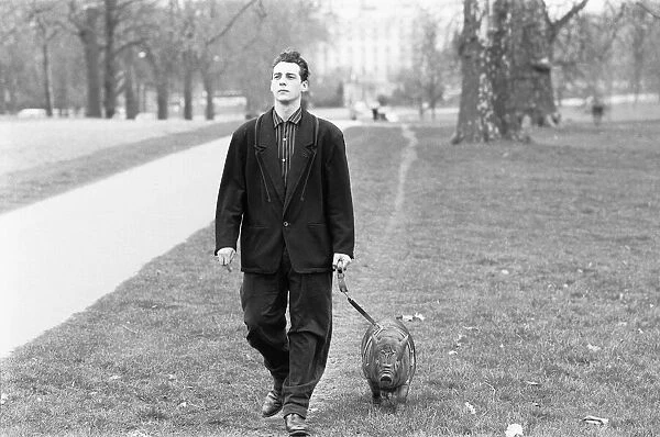 Not an everyday sight. A man walks his pig in Hyde Park. 17th March 1987