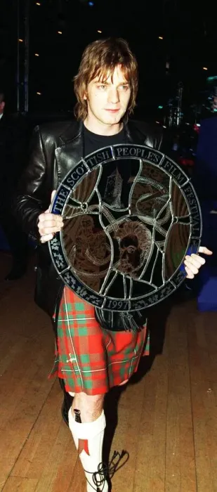 Framed Print : Ewan McGregor actor carrying award Scottish Peoples Film Festival 1997 round targe like