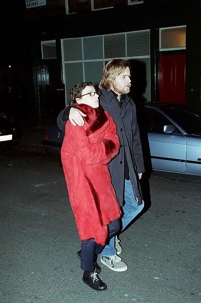 Ewan Mcgregor Actor February 1999, walking down London street with his arm around unknown
