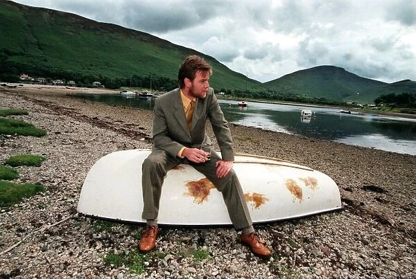 Ewan McGregor on the Isle of Arran July 1998 with bottle of Loch Ranza single malt whisky