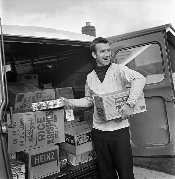 Ex Blackburn and England winger Bryan Douglas loading his grocery van ready for a day