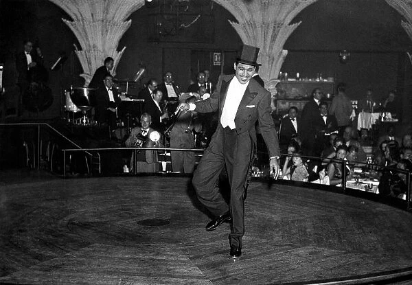 Ex - boxer Sugar Ray Robinson entertaining at a show business party in London