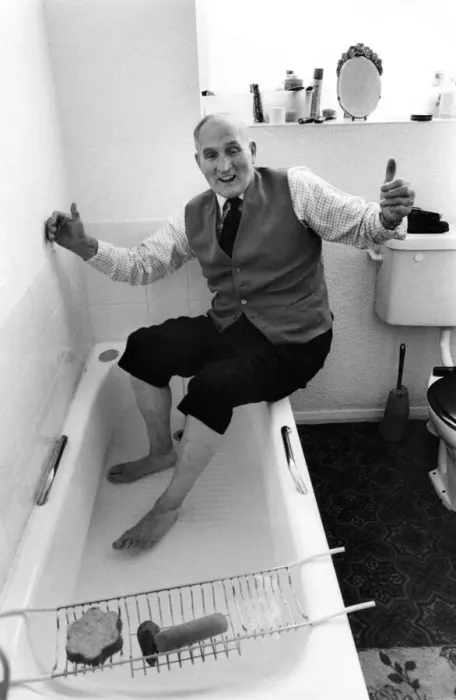 Framed Print : Ex pitman sixty nine year old Bill Newby celebrating getting a proper bath installed in