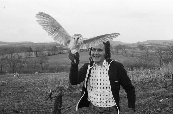 Ex-pop singer Billy Fury with a barn owl. The bird has been brought from his London home