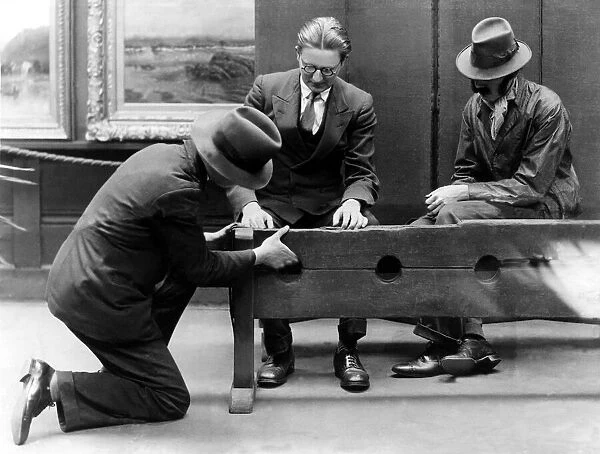 Examining the ancient stocks in Sunderland Museum on 8th July 1932