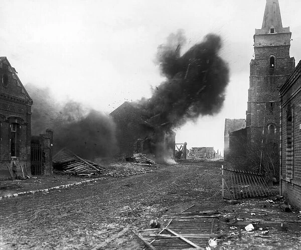 An explosion in a large house which had been fired by the Germans during preamble to