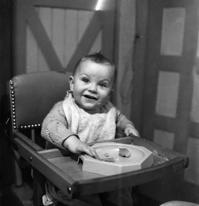 Framed Print : Expressions. An 11 month old child smiling with his food. January 1950 Framed Print : Expressions. An 11 month old child smiling with his food. January 1950