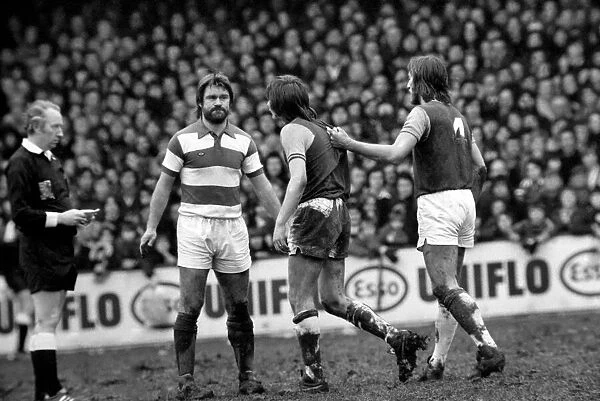 F. A. Cup: West Ham (2) vs. Queens Park Ranger (1). Bonds holds angry Kieth Robson back as