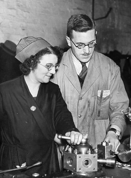 Factory worker Miss D Odell at work in a Birmingham munitions factory during the Second