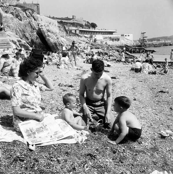 Families on the beach at Plymouth: Mr. Fred Giles with his wife Doreen