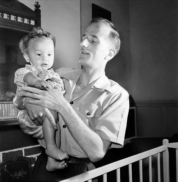 Families. Father and baby boy. July 1953 D3424