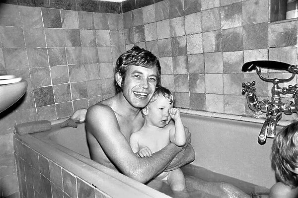 Families: Mother, father and children. Father in the bath with baby boy and son