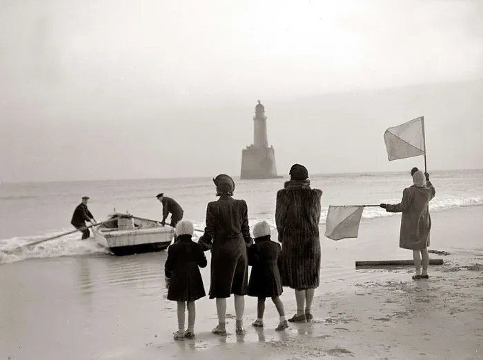 Framed Print : The families of the Rattray Head lighthouse keepers semaphore their loved ones as Old Framed Print : The families of the Rattray Head lighthouse keepers semaphore their loved ones as Old